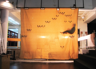 Illustration for article titled Designer creates a narrow house suspended between two sheets of fabric
